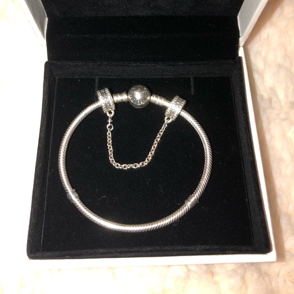 Pandora Sterling silver bracelet and clip chain.